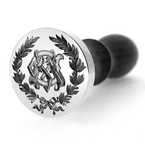 Seal engraved custom Edwardian DM monogram inside a laurel wreath on a brass table seal
