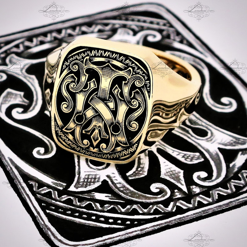 Yellow gold cushion shape signet ring hand engraved with a custom designed TW or WT monogram, with black enamel