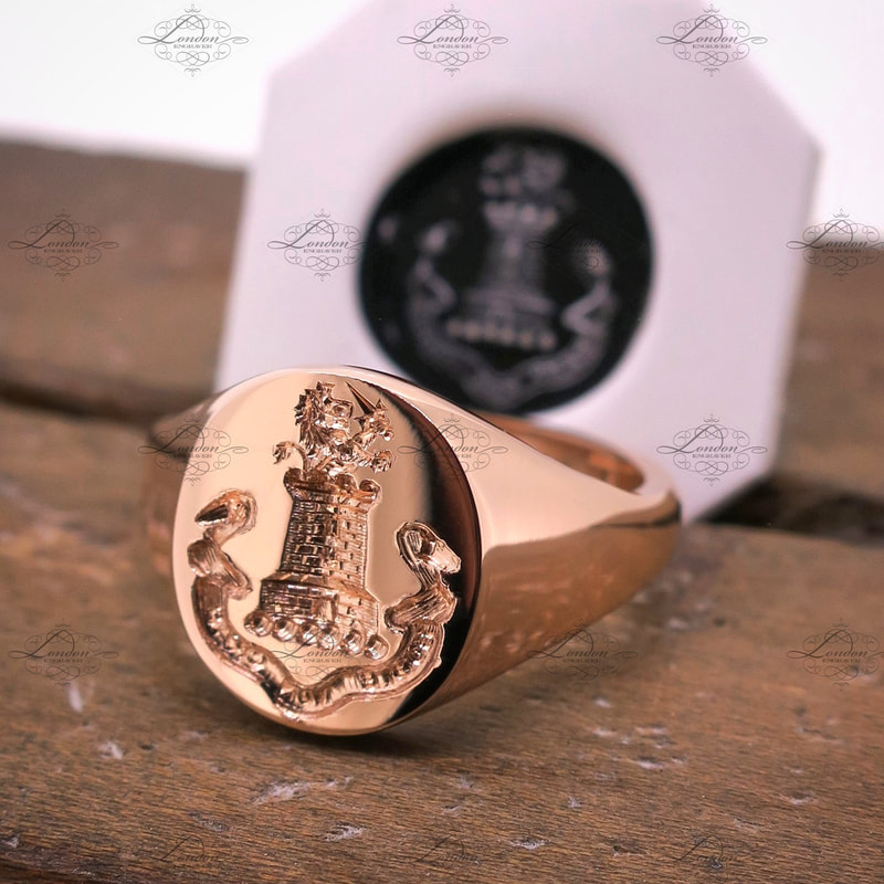 Seal engraved crest and latin motto in a banner on a rose gold signet ring, with wax impression.