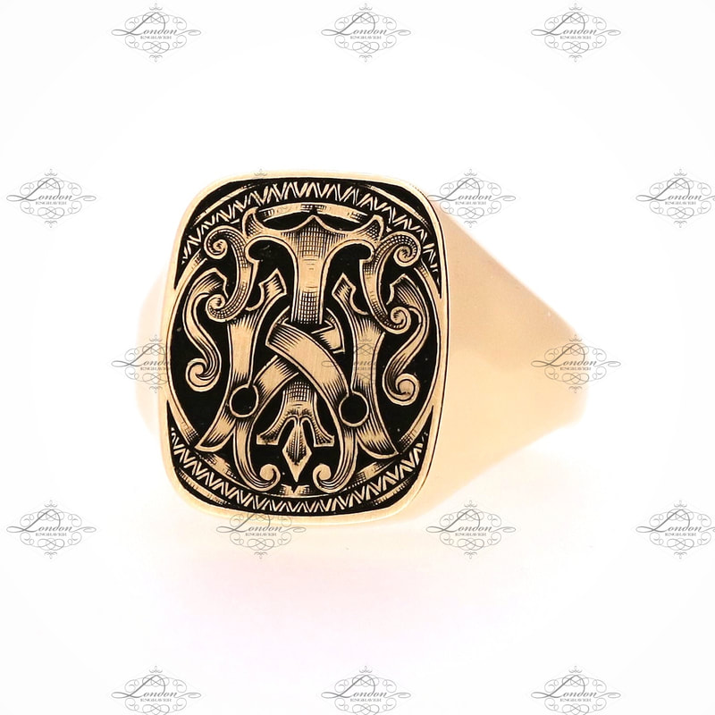 TW or WT monogram on an 18x15 cushion yellow gold signet ring