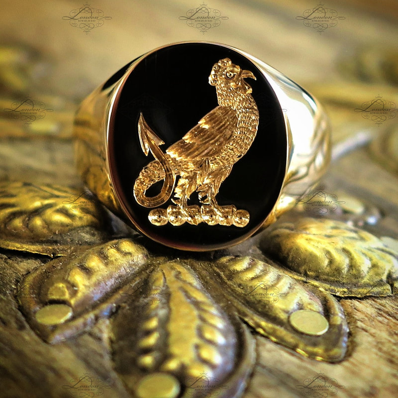 22ct yellow gold signet ring with a seal engraved family crest