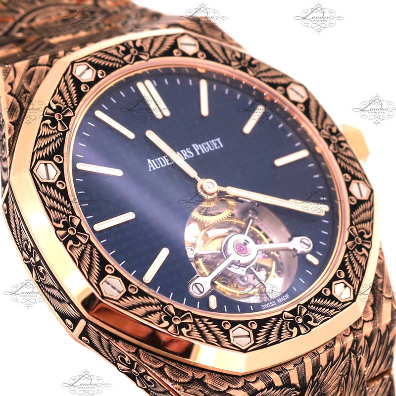 18ct rose gold Audemars Piguet watch face hand engraved with a flight theme - wings and propellers. Tourbillion movement