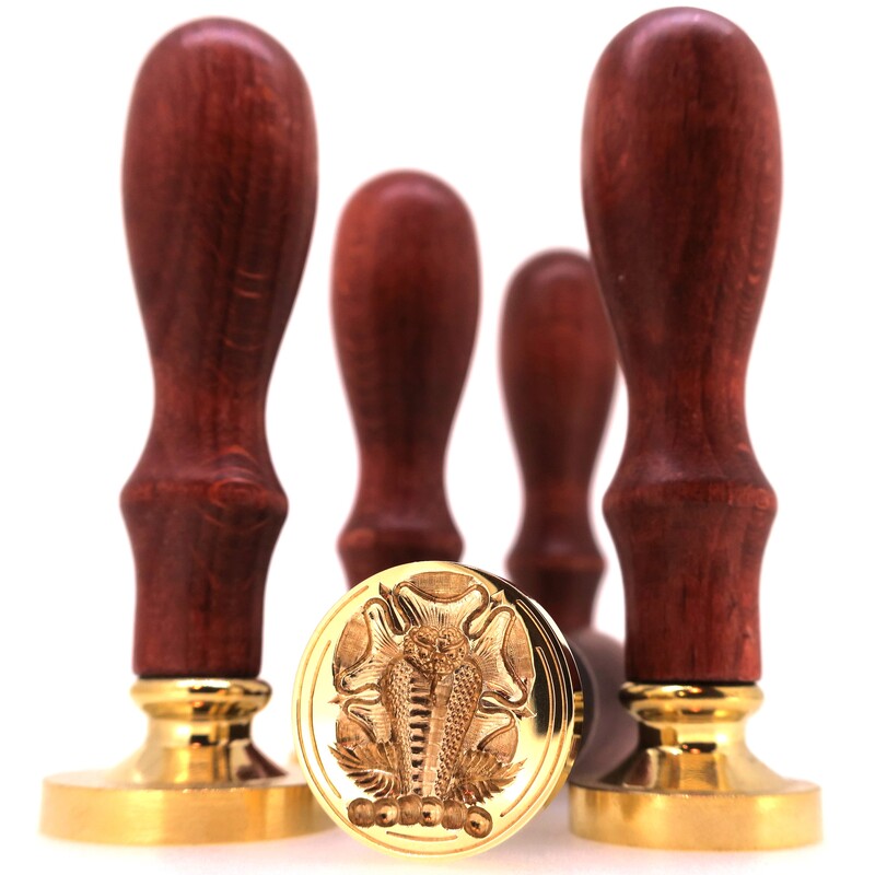 Selection of brass table seals with wooden handles, one has a seal engraved Crest